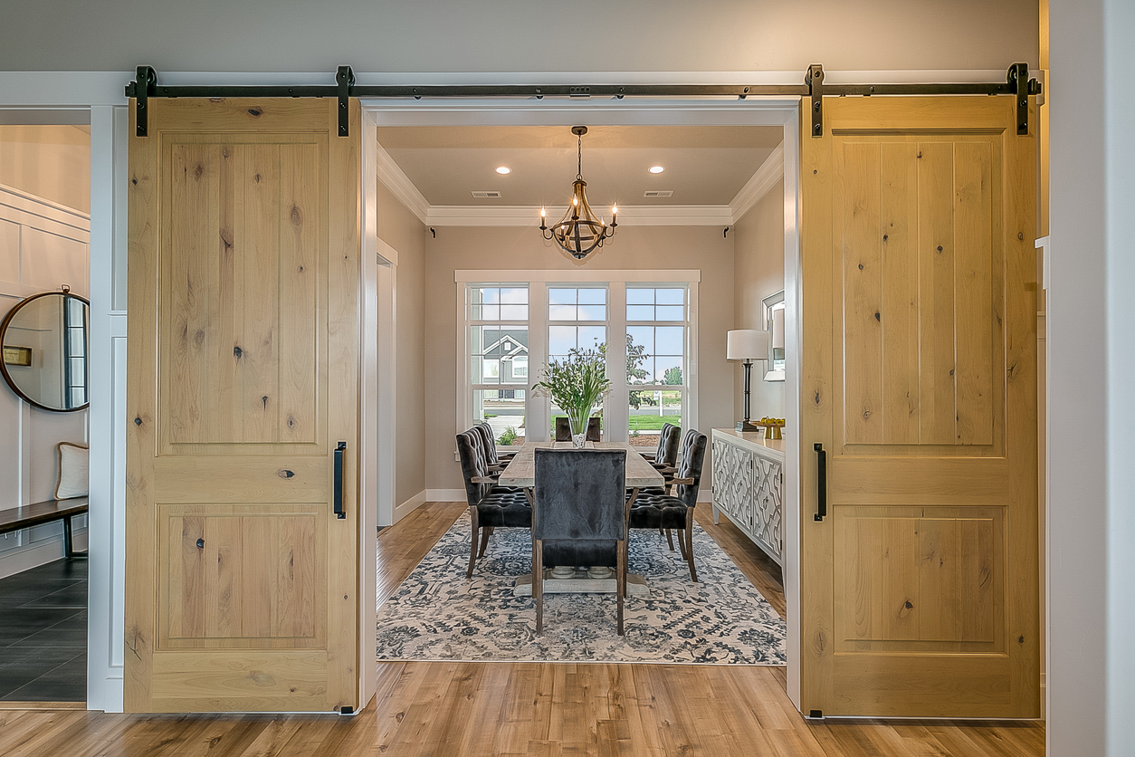 Exquisite dining room with double barn door entrance